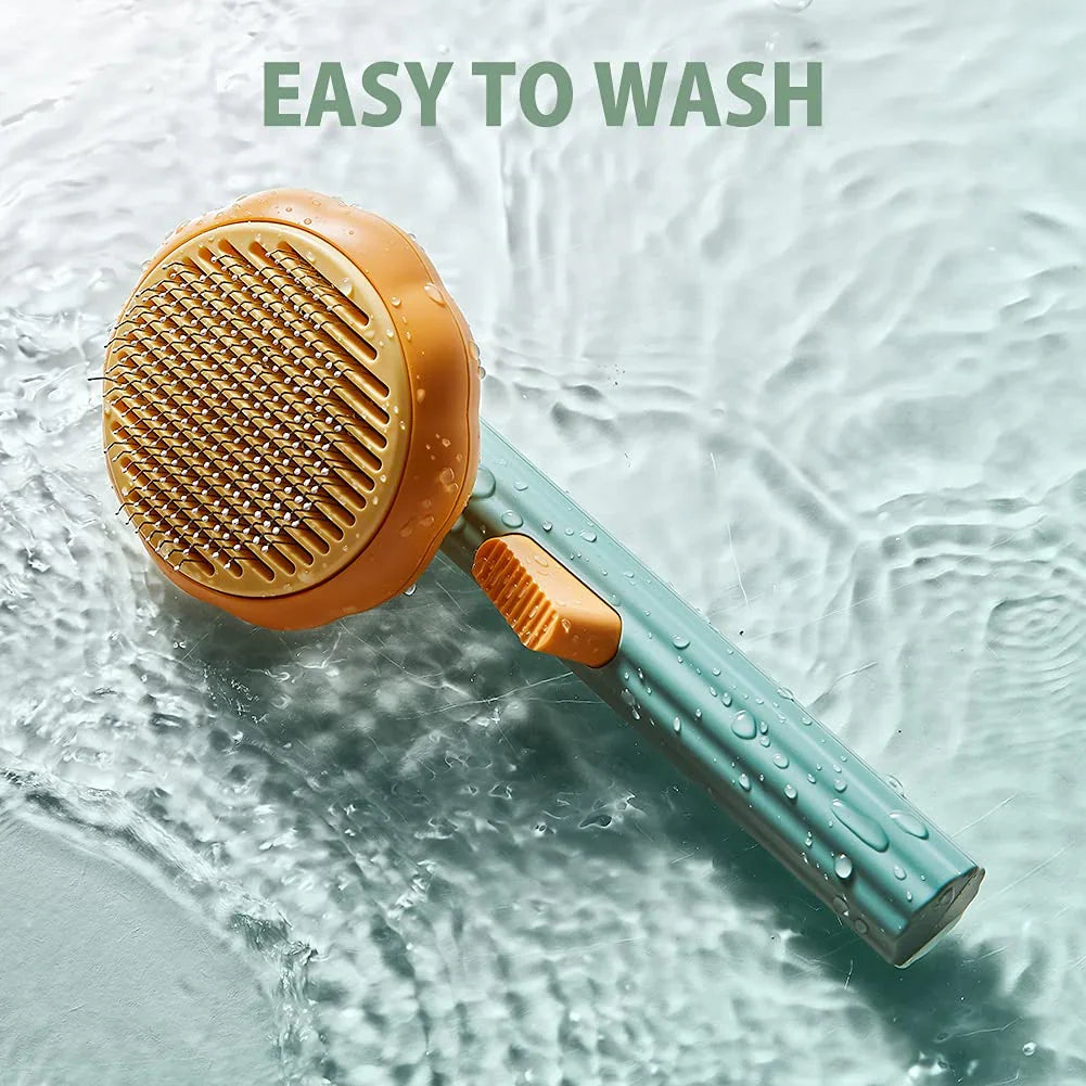 Pet grooming brush with orange bristle head and blue handle on a water background, labeled 'Easy to Wash'.